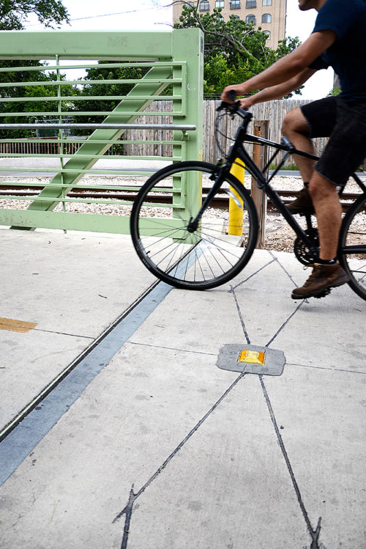 The Eco-Counter Multi product uses passive infrared sensors to count pedestrians and inductance loops in the pavement to count bicyclists traveling in both directions.